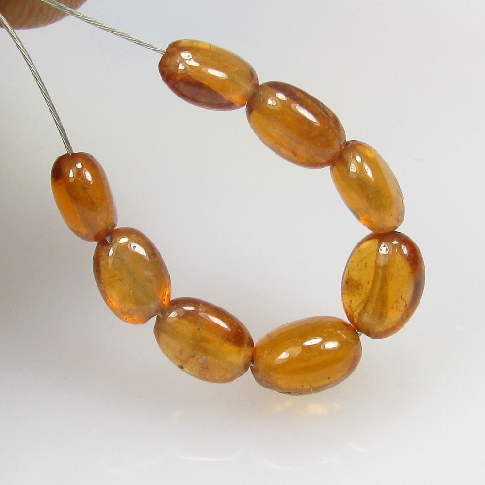 5.49 Ct Natural 8 Hessonite Garnet Loose Beads: Weight - 5.49 Ct / Size - 4.0x2.8 - 4.6x2.6 mm / 8 Pc's / Shape - Dumble Beads / Clarity - VVS / Origin - Nigeria / Treatment - None