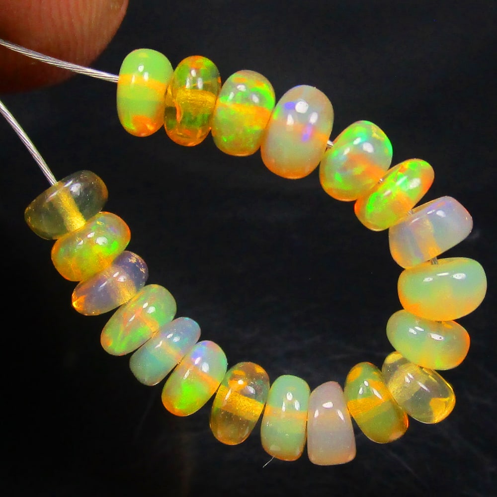 3.12 Ct Natural 20 Drilled Multi-color Fire Opal Loose Beads: Weight - 3.12 Ct / Size - 3.60 - 3.90 mm / Pieces - 20 No's / Shape -Round Beads / Color - Multicolor / Clarity - Transparent / Origin - Ethiopia / Treatment - None