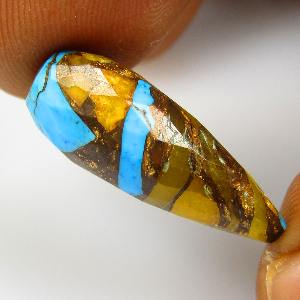 9.78Ct Natural Composite Howlite Loose Stone: Weight - 9.78 Ct / Size - 24.00 x 8.20 x 8.20 mm / Shape - Pear Drop / Color - Multicolor / Clarity - Opaque / Origin - Brazil / Treatment - Dyed