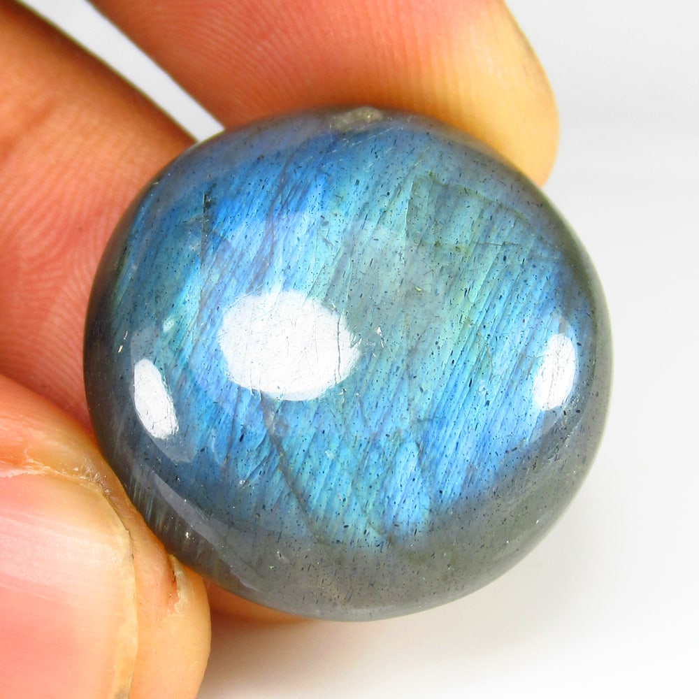31.51 Ct Natural Labradorite Loose Stone: Weight - 31.51 Ct / Size - 24.00 x 24.00 x 6.10 mm / Shape - Excellent Round Cab / Clarity - Opaque / Origin - Africa / Treatment - None