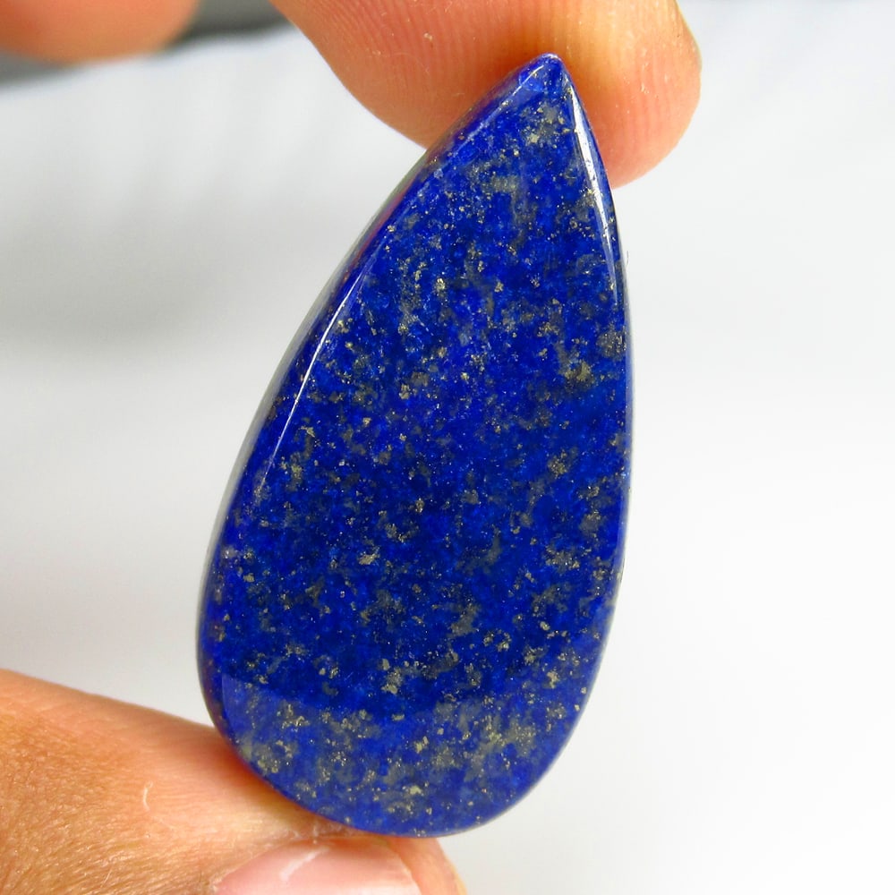32.35 Ct Natural Blue Lapis Lazuli Loose Stone: Weight - 32.35 Ct / Size - 31.00 x 16.90 x 6.10 mm / Shape - Pear Cab / Clarity - Opaque / Origin - Afghanisthan / Treatment - None