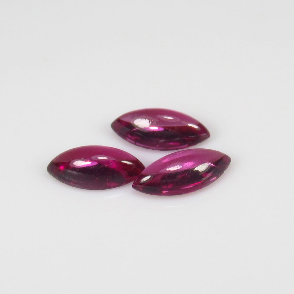 1.56 Ct Natural Rose Garnet Set Loose Stones: Weight - 1.56 Ct / Size - 7.0x3.5 - 7.3x3.6 mm / 3 PC's / Shape - Marquise Cab / Clarity - VVS / Origin - Nigeria / Treatment - None