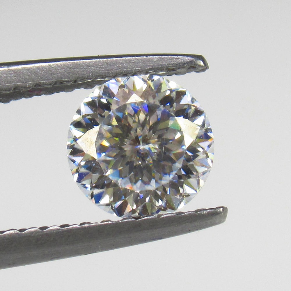 0.79 Ct Moissanite Loose Stone: Weight - 0.79 Ct / Size - 6.00 x 6.00 x 3.70 mm / Shape - Round Cut / Color - White / Clarity - VVS / Origin - Arizona / Treatment - Lab created by natural diamond powder