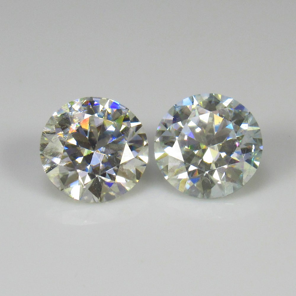 1.87 Ct Moissanite Pair Loose Stones: Weight - 1.87 Ct / Size - 6.50 x 6.50 x 4.00 mm / Shape - Round Cut / Color - White / Clarity - VVS / Origin - Arizona / Treatment - Lab created by natural diamond powder