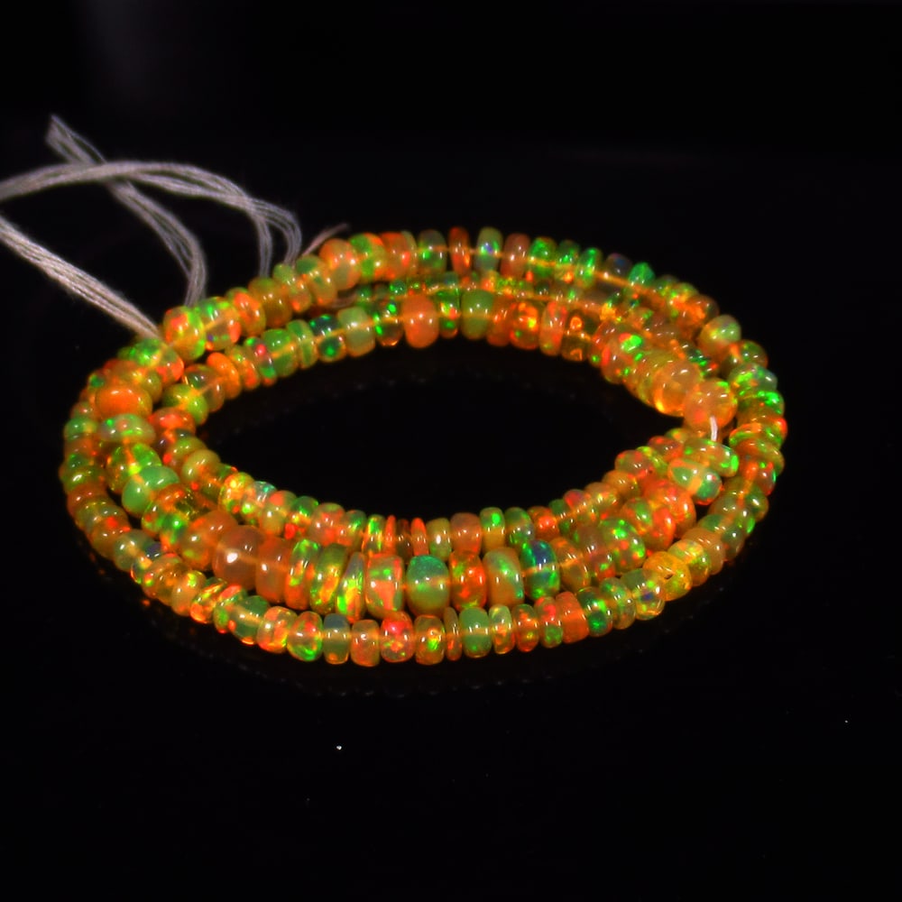 30.94 Ct Natural 188 Drilled Multi-color Fire Opal Loose Beads Certified Natural earthmined: Weight - 30.94 Ct / Size - 2.60 - 4.80 mm / Pieces - 188 No's / Shape -Round Beads / Color - Multicolor / Clarity - Transparent / Origin - Ethiopia / Treatment - None
