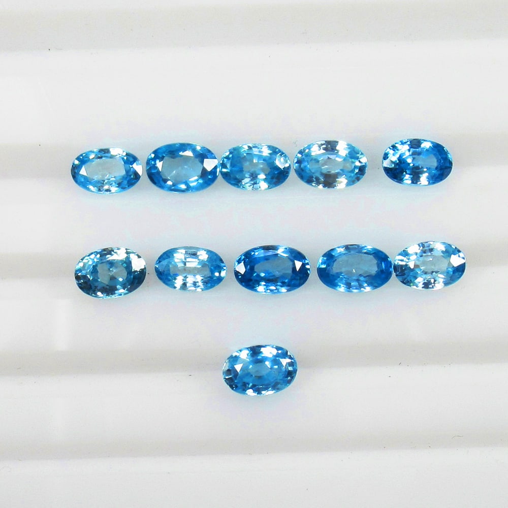7.41 Ct Natural Blue Zircon Set Loose Stones Certified Natural earthmined Gemstones: Weight - 7.41 Ct / Size - 6.0x4.0 - 6.3x4.2 mm / 11 Pc's / Shape - Oval Cut / Color - Blue / Clarity - VVS / Origin - Cambodia / Treatment - Gentle Heat