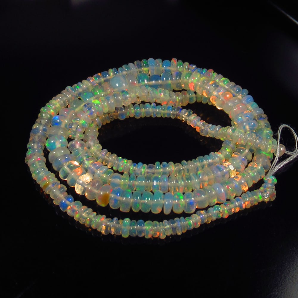30.24 Ct Natural 283 Drilled Multi-color Fire Opal Loose Beads Certified Natural earthmined: Weight - 30.24 Ct / Size - 2.80 - 5.90 mm / Pieces - 283 No's / Shape - Round Beads / Color - Multicolor / Clarity - Transparent / Origin - Ethiopia / Treatment - None