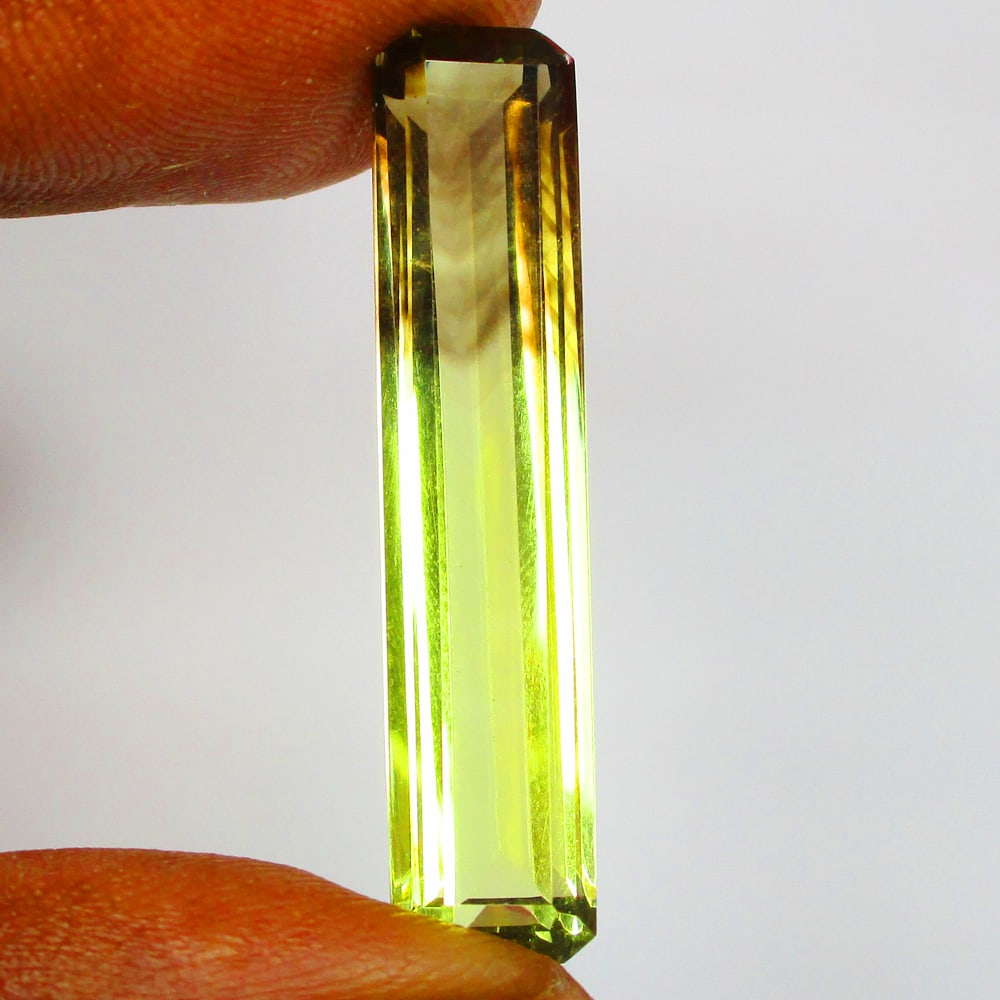 12.91 Ct Natural Bi-color Lemon Quartz Loose Stone: Weight - 12.91 Ct / Size - 35.00 x 7.30 x 6.30 mm / Top Quality Luster / Excellent Octagon Cut / Origin - Brazil / Treatment - None