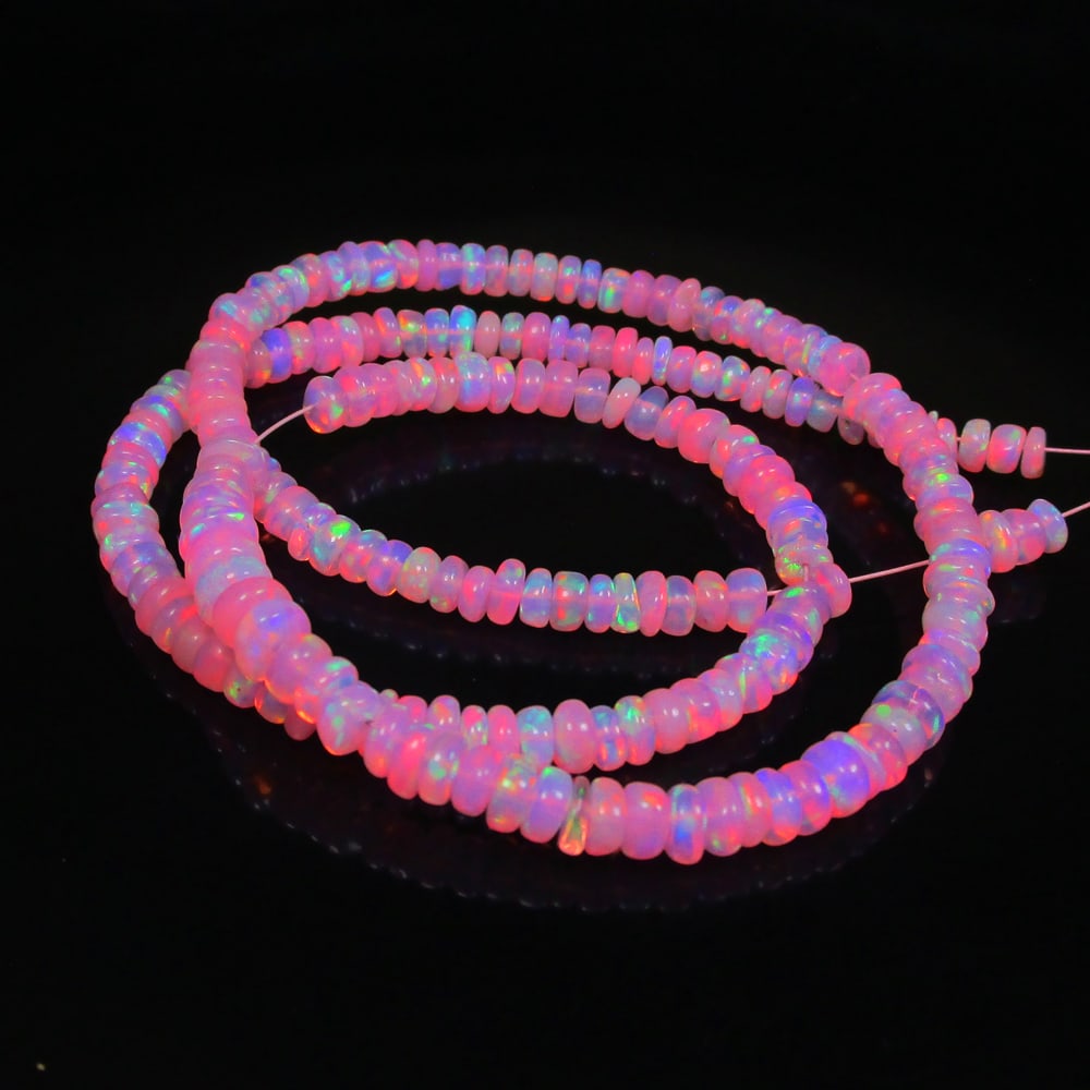 37.38 Ct Natural 203 Drilled Pink Fire Opal Loose Beads: Weight - 37.38 Ct / Size - 4.00 to 5.20 mm / Pieces - 203 No's / Shape - Round Beads / Color - Pink / Clarity - Transparent / Origin - Ethiopia / Treatment - Heated
