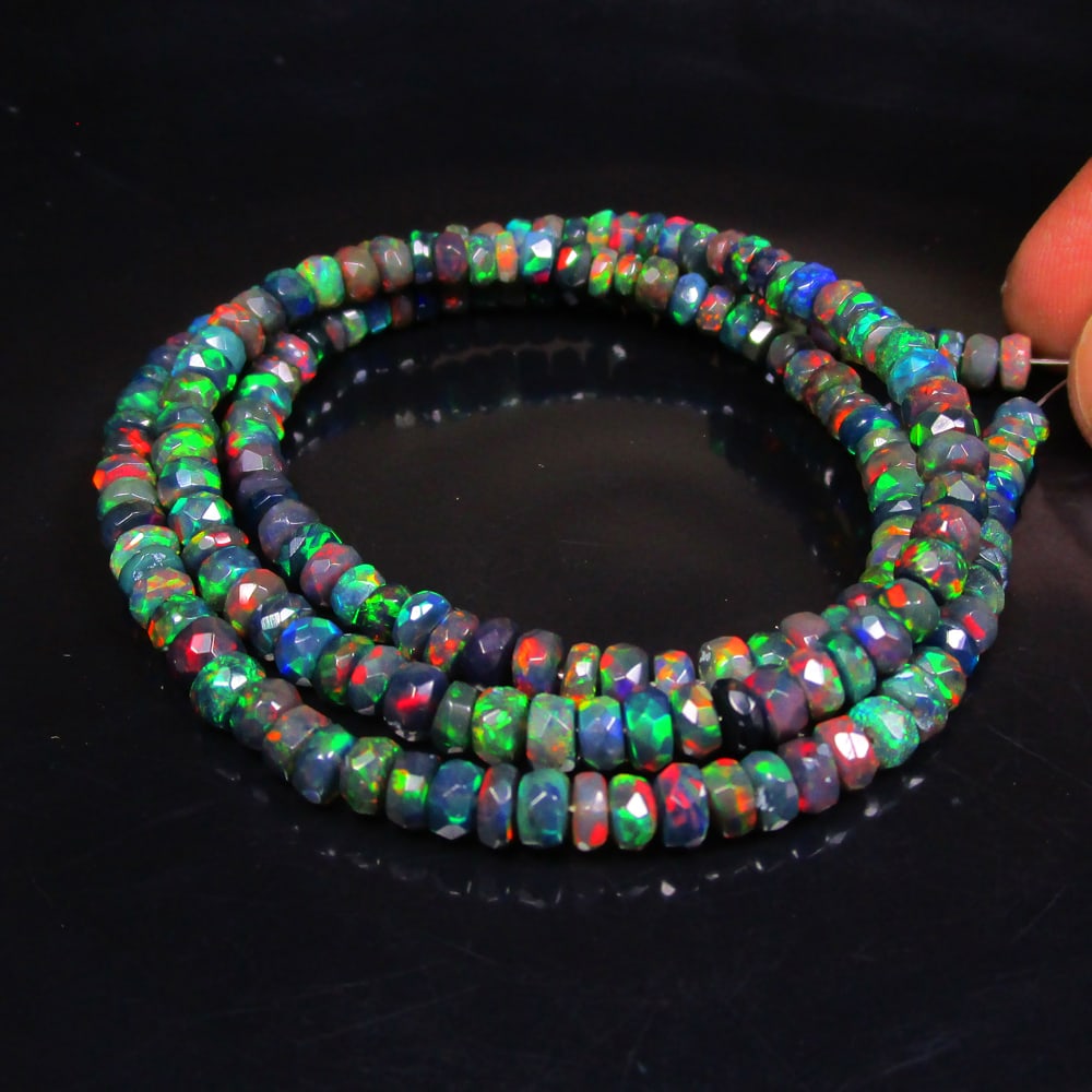 51.47 Ct Natural 189 Black Fire Opal Loose Beads: Weight - 51.47 Ct / Size - 3.80- 4.80 mm / 189 Pc's / Shape - Round Beads / Color - Black / Clarity - Translucent / Origin - Ethiopia / Treatment - Heated