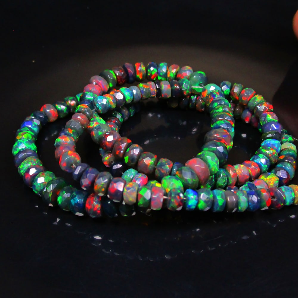 59.74 Ct Natural 164 Black Fire Opal Loose Beads: Weight - 59.74 Ct / Size - 3.90- 6.40 mm / 164 Pc's / Shape - Round Beads / Color - Black / Clarity - Translucent / Origin - Ethiopia / Treatment - Heated