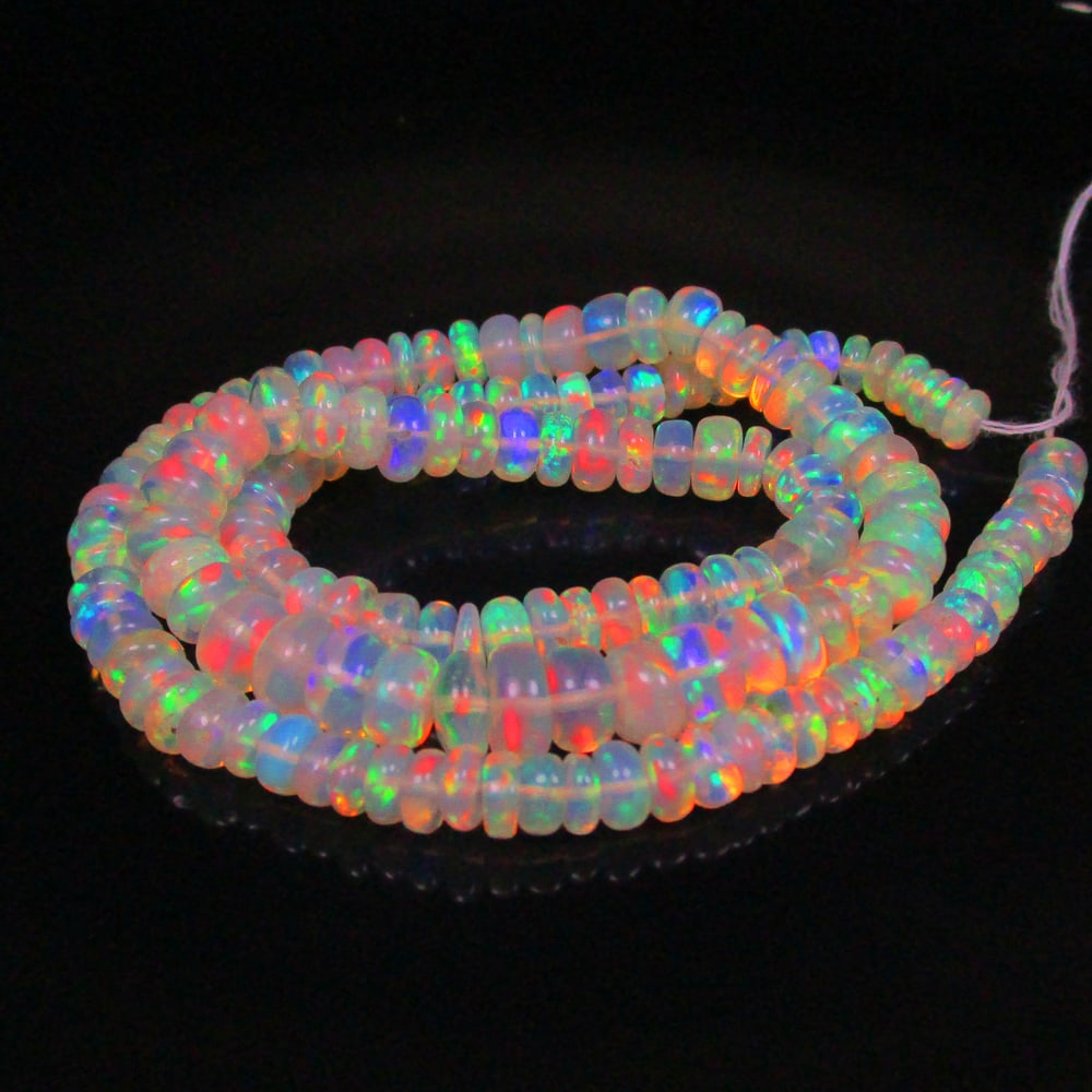 52.66 Ct Natural 153 Drilled Multi-color Fire Opal Loose Beads: Weight - 52.66 Ct / Size - 4.70 - 6.90 mm / Pieces - 153 No's / 15" inches / Shape -Round Beads / Color - Multicolor / Clarity - Transparent / Origin - Ethiopia / Treatment - None
