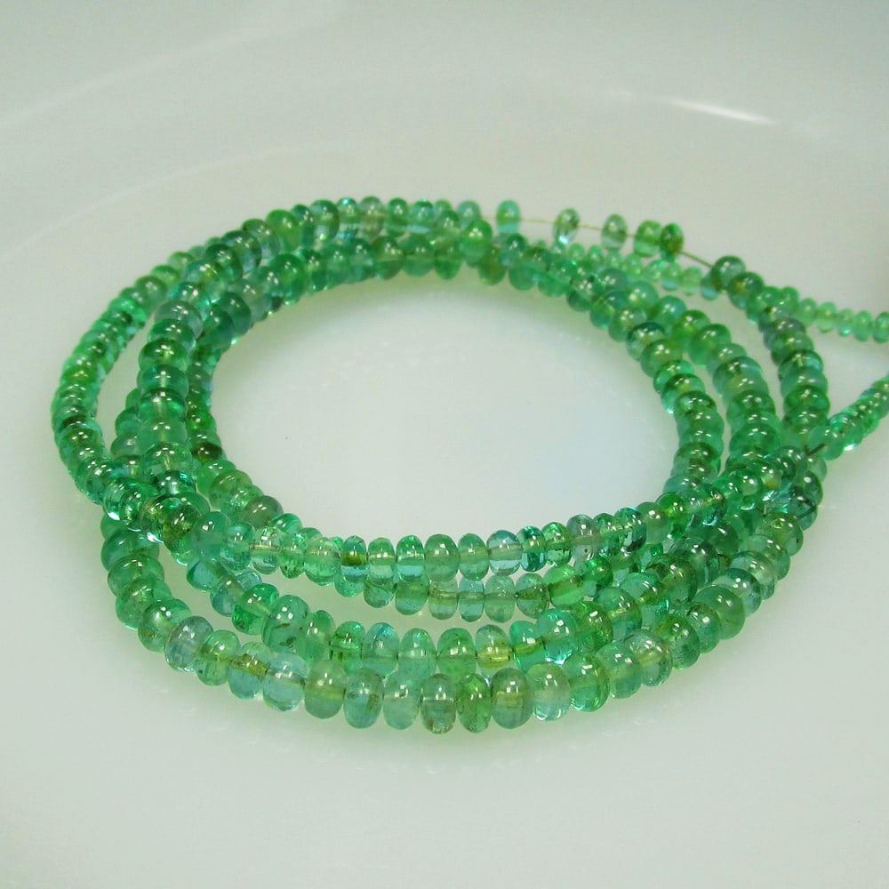 57.95 Ct Natural 279 Emerald Loose Beads: Weight - 57.95 Ct / Size - 2.20 - 4.10 mm / 279 Pc's / Shape - Drilled Round Beads / Color - Green / Clarity - SI / Origin - Zambia / Treatment - Colorless Oil