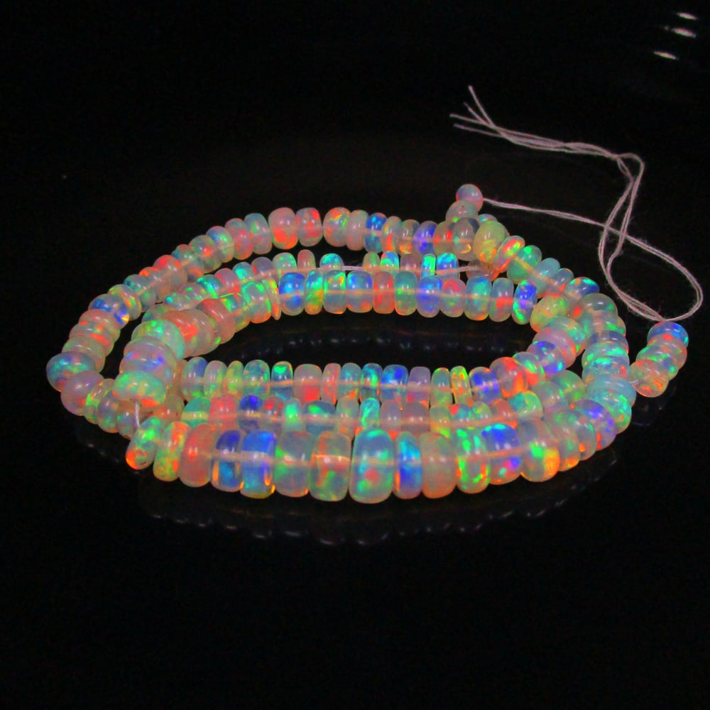 53.17 Ct Natural 146 Drilled Multi-color Fire Opal Loose Beads: Weight - 53.17 Ct / Size - 4.40 - 7.10 mm / Pieces - 146 No's / 14" inches / Shape -Round Beads / Color - Multicolor / Clarity - Transparent / Origin - Ethiopia / Treatment - None