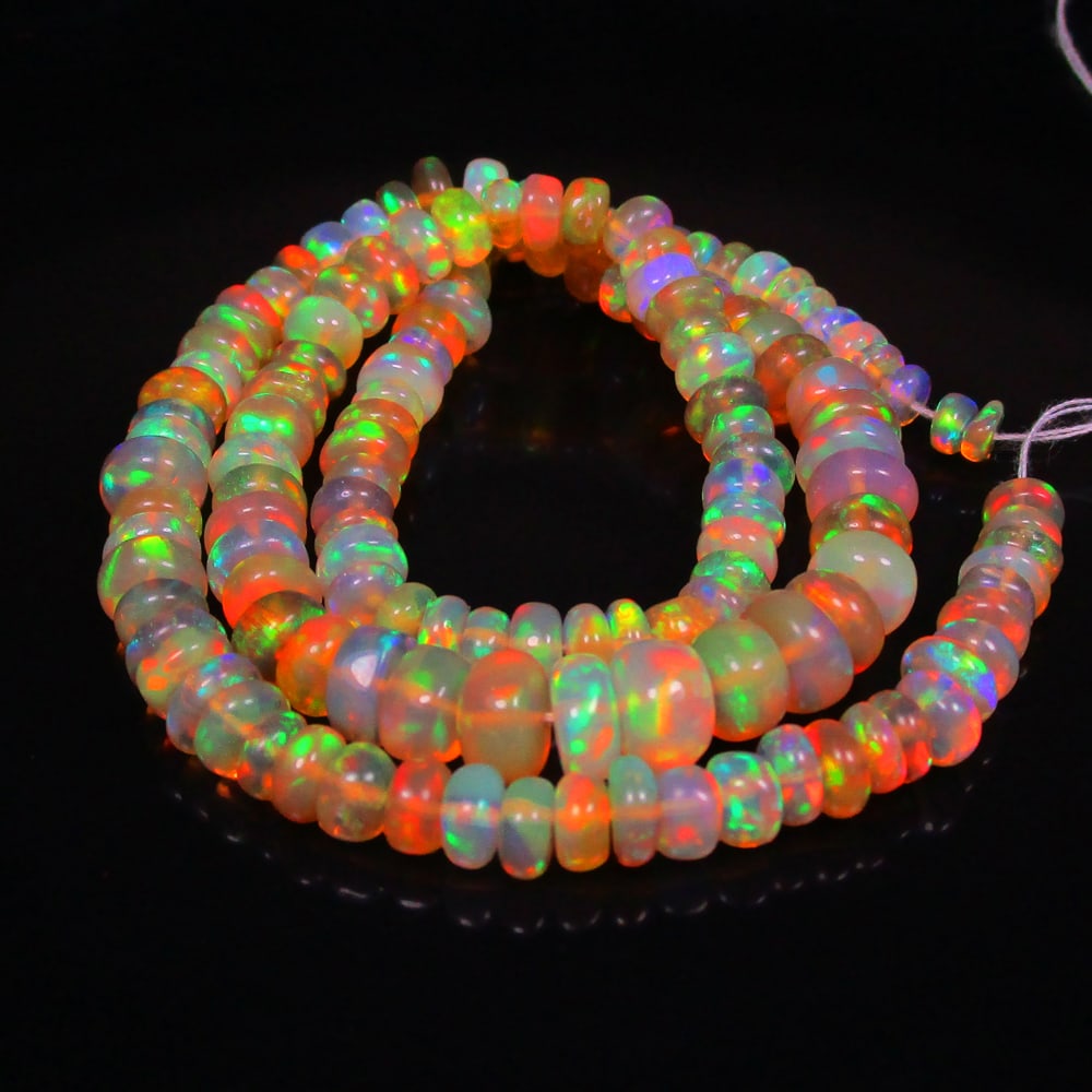 53.39 Ct Natural 142 Drilled Multi-color Fire Opal Loose Beads: Weight - 53.39 Ct / Size - 3.80 - 6.90 mm / Pieces - 142 No's / 14" inches / Shape -Round Beads / Color - Multicolor / Clarity - Transparent / Origin - Ethiopia / Treatment - None