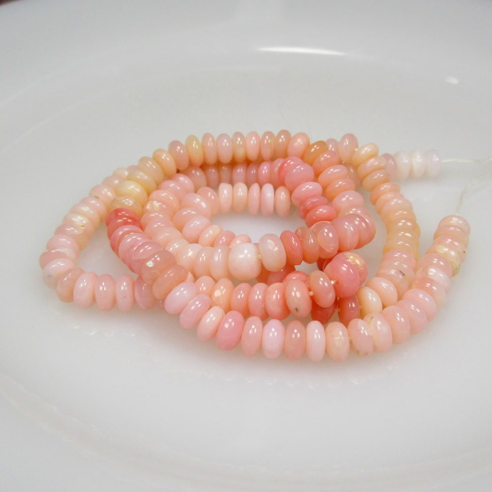 84.60 Ct Natural 173 Pink Opal Loose Beads: Weight - 84.60 Ct / Size - 5.30 - 5.70 mm / 173 Pc's / 19" inches / Shape - Round Beads / Color - Pink / Clarity - Opaque / Origin -Peru / Treatment - None