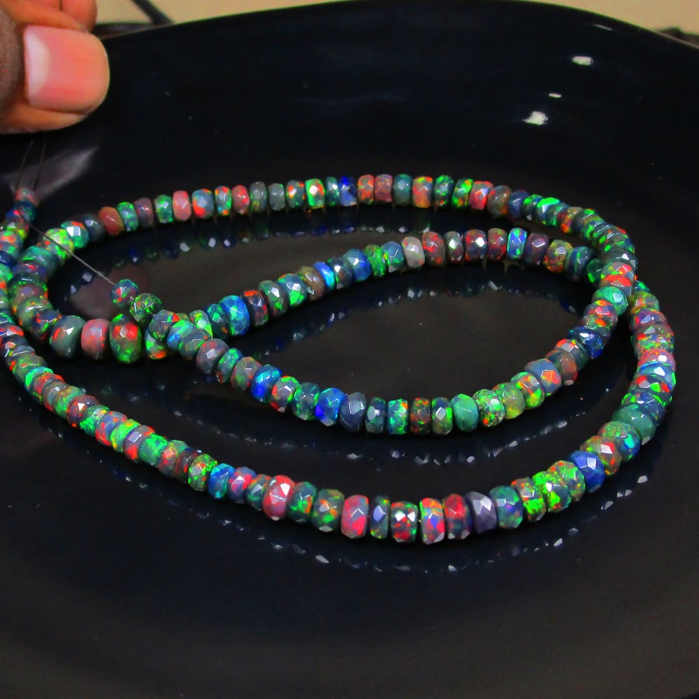 66.34 Ct Natural 160 Black Fire Opal Loose Beads: Weight - 66.34 Ct / Size - 4.20- 7.10 mm / 160 Pc's / Shape - Round Beads / Color - Black / Clarity - Translucent / Origin - Ethiopia / Treatment - Heated