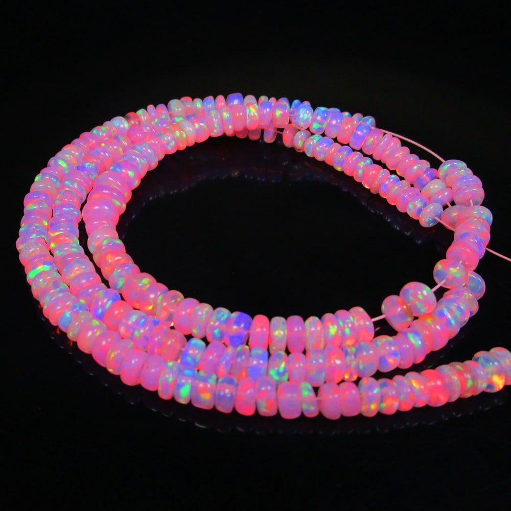 37.74 Ct Natural 202 Drilled Pink Fire Opal Loose Beads: Weight - 37.74 Ct / Size - 3.70 to 5.50 mm / Pieces - 202 No's / Shape - Round Beads / Color - Pink / Clarity - Transparent / Origin - Ethiopia / Treatment - Heated