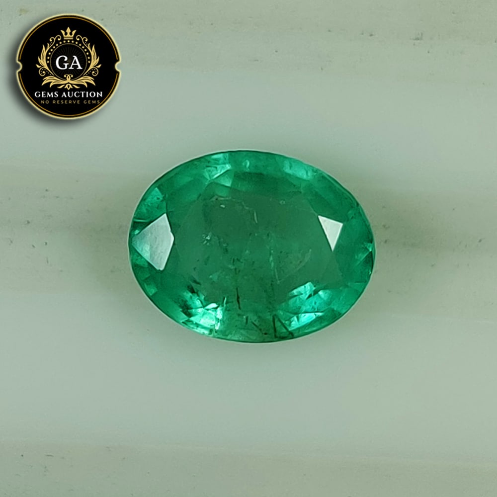 1.87 Ct Natural Grassy Green Emerald Oval Cut: Weight - 1.87 Ct / Size - 9.30 x 7.50 x 4.40 mm / Shape - Oval Cut / Color - Green / Clarity - SI / Origin - Zambia / Treatment - Colorless Oil