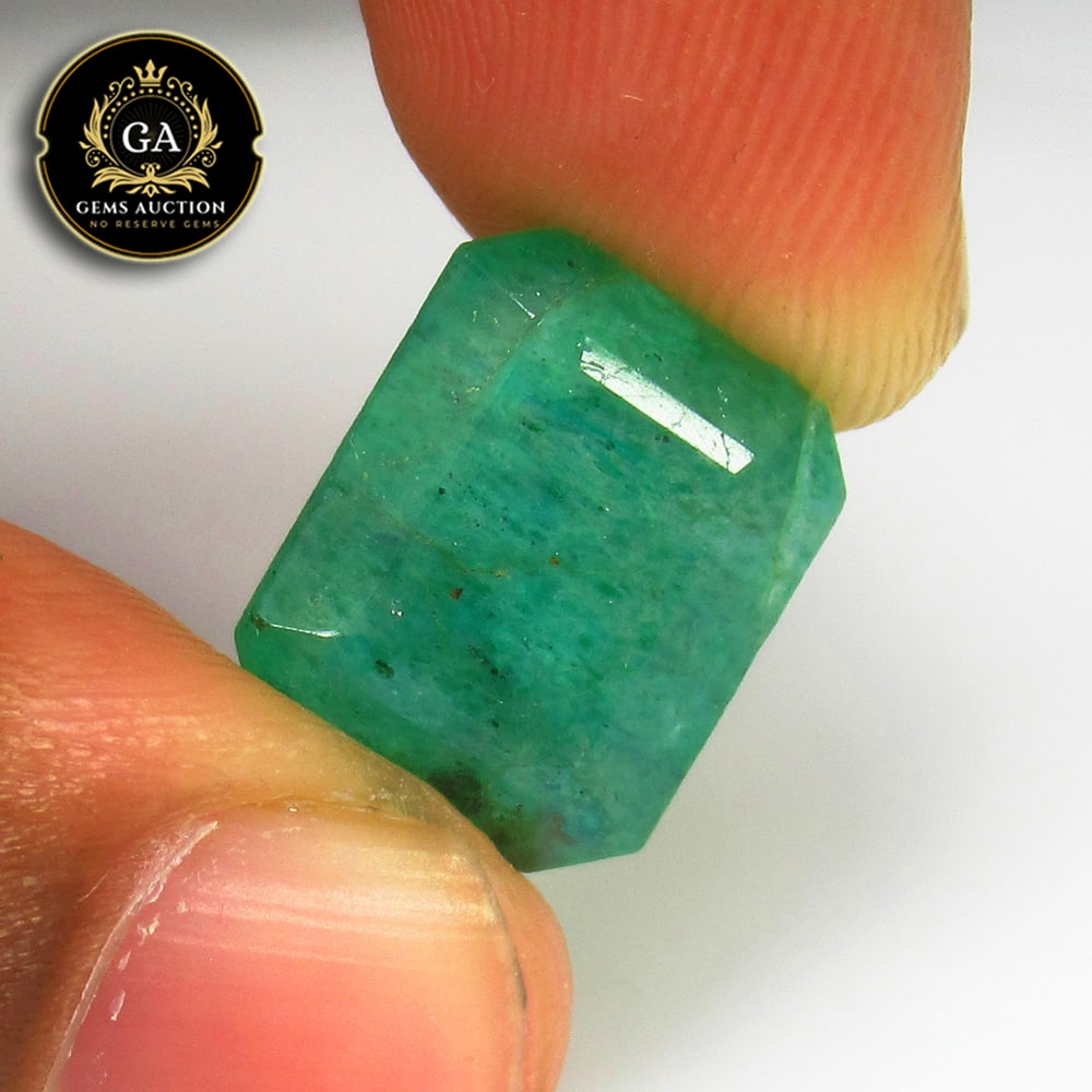 9.08 Ct Coated Grassy Green Emerald Octagon Cut: Weight - 9.08 Ct / Size - 14.00 x 11.20 x 7.70 mm / Shape - Octagon Cut / Color - Green / Clarity - SI / Origin - Zambia / Treatment - Color Coated