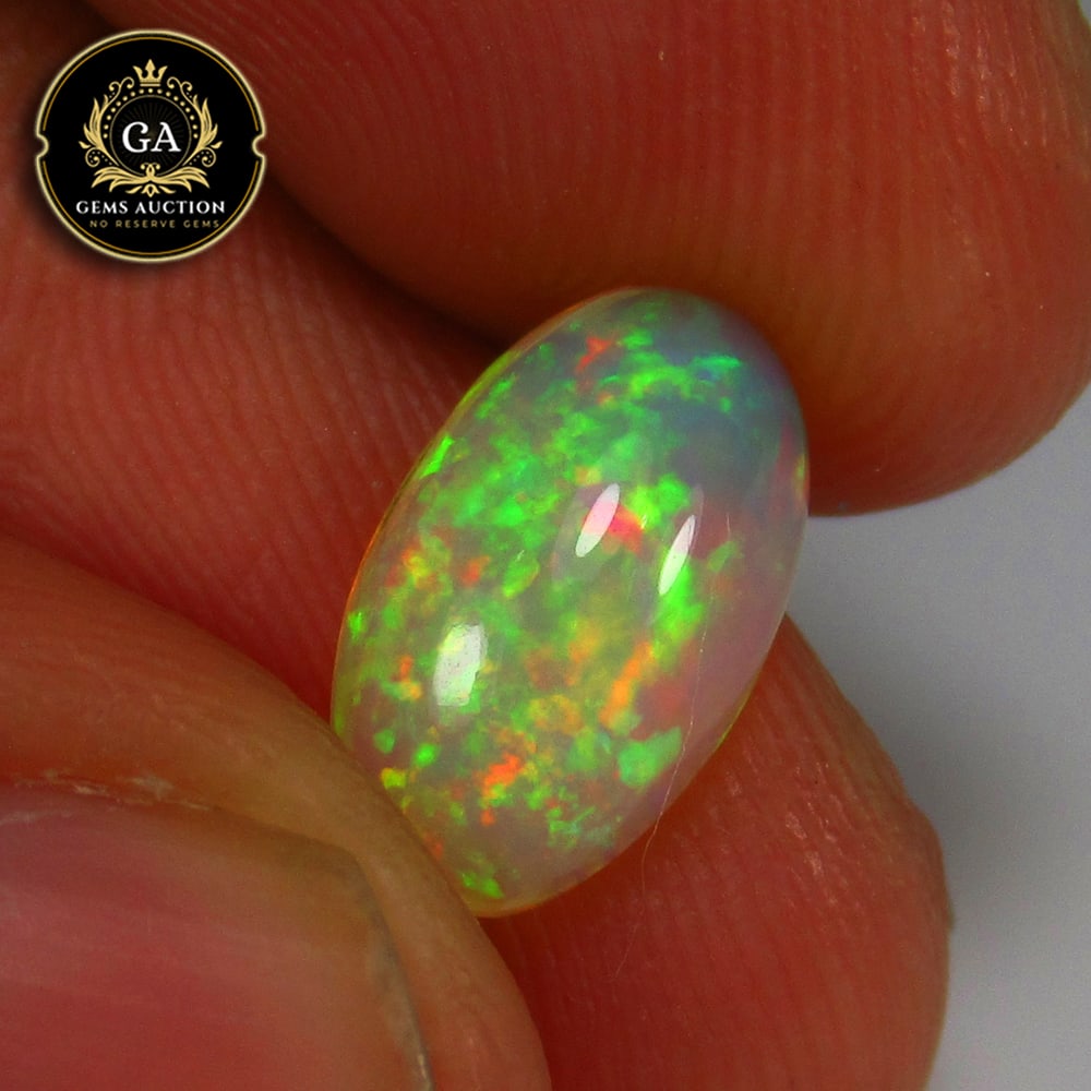 1.66 Ct Natural Multicolor Top Welo Opal Flash Fire Oval Cab: Weight - 1.66 Ct / Size - 11.80 x 7.00 x 4.40 mm / Shape - Oval Cab / Color - Multicolor / Clarity - Translucent / Origin - Ethiopia / Treatment - None