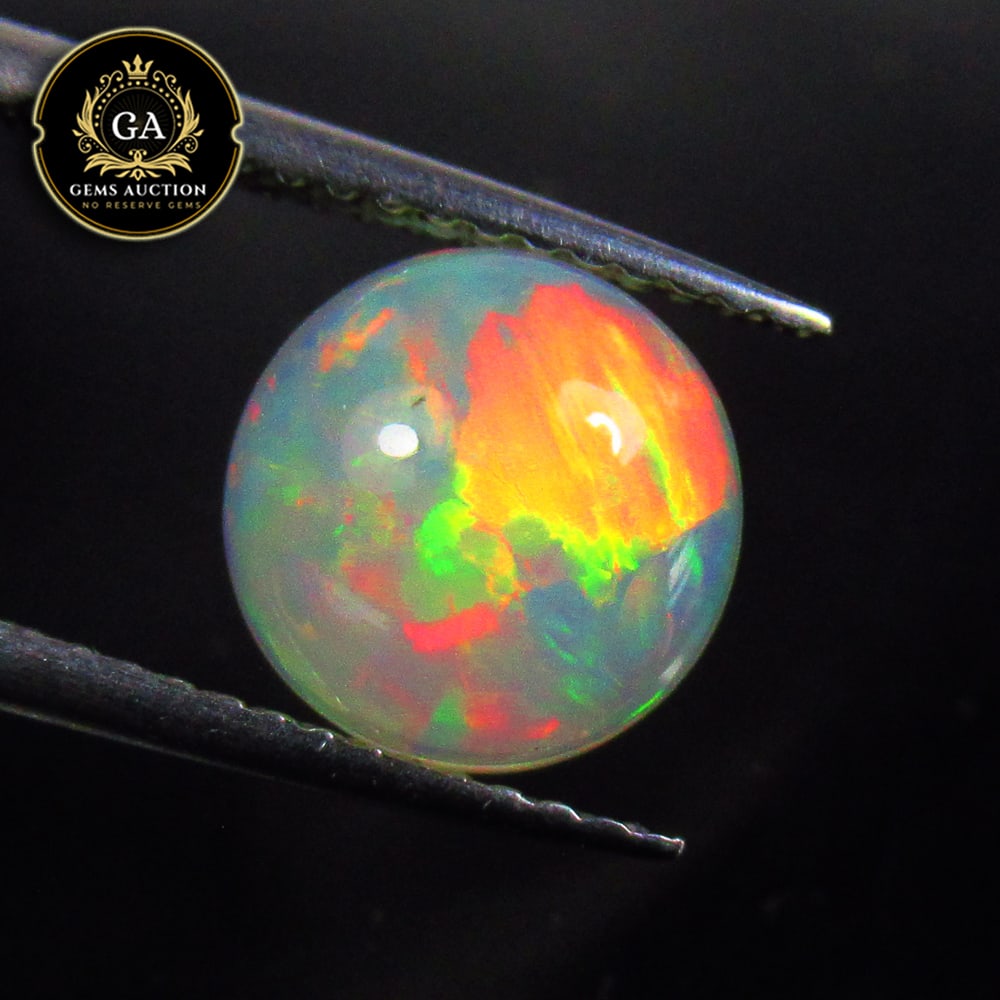 1.39 Ct Natural Ethiopian Multicolor Welo Opal  Round Cab (1 of 3)