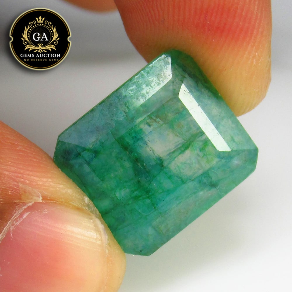 17.24 Ct Coated Grassy Green Emerald Octagon Cut: Weight - 17.24 Ct / Size - 17.00 x 15.00 x 7.50 mm / Shape - Square Octagon Cut / Color - Green / Clarity - SI / Origin - Zambia / Treatment - Color Coated
