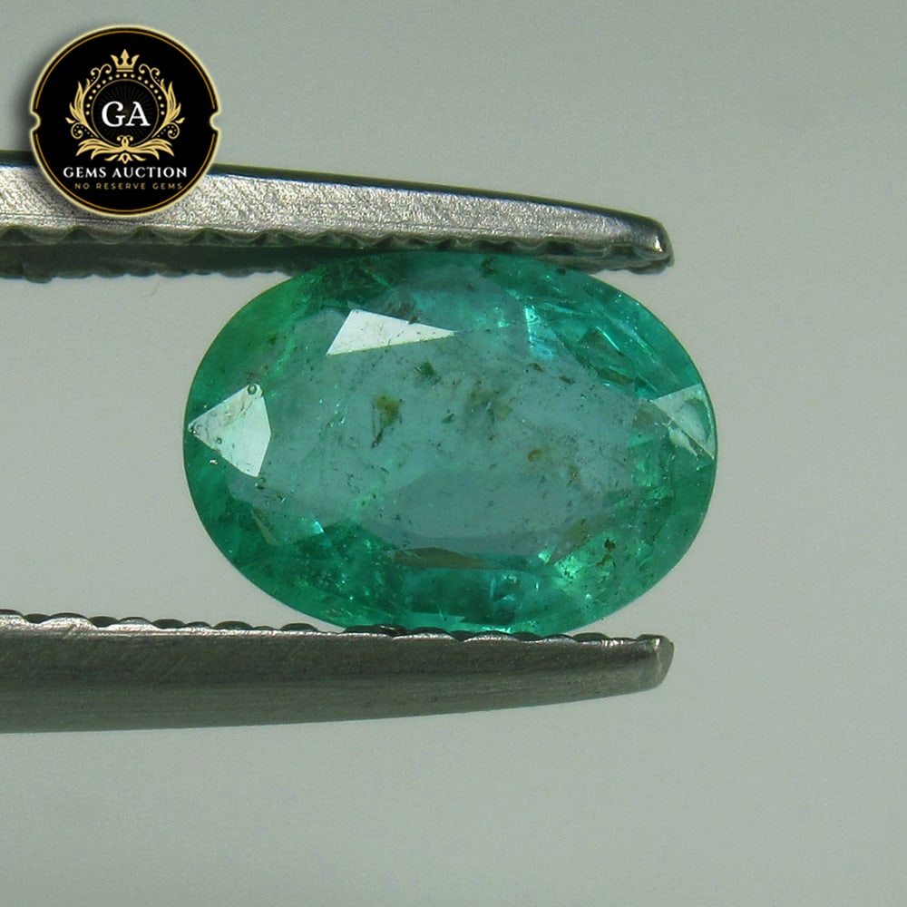 0.83 Ct Natural Grassy Green Emerald Oval Cut: Weight - 0.83 Ct / Size - 7.00 x 5.00 x 3.00 mm / Shape - OVal Cut / Color - Green / Clarity - SI / Origin - Zambia / Treatment - Colorless Oil