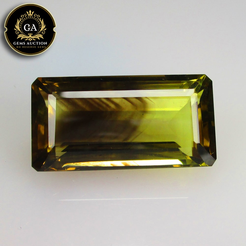 24.63 Ct Natural Bi-Color Lemon Quartz Octagon Cut: Weight - 24.63 Ct / Size - 27.00 x 13.00 x 9.30 mm / Clariry - VVS / Top Class Luster / High Class Quality / Excellent Octagon Cut / Origin - Africa / Hardness - 7.0 / Treatment - None