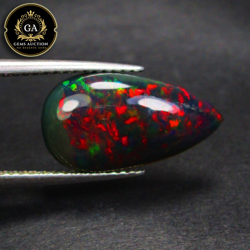 2.97 Ct Natural Black Flashing Fire Opal Pear Cab (1 of 3)
