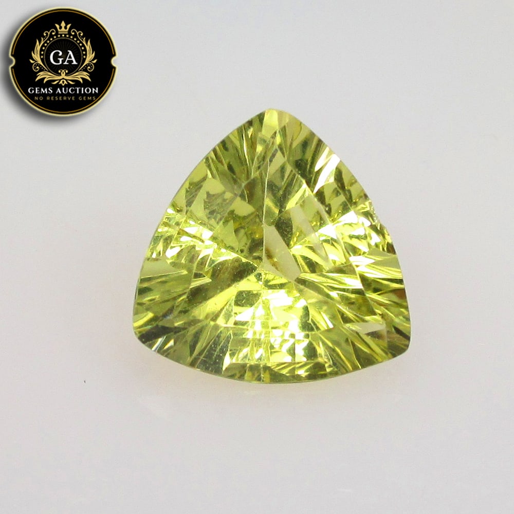 3.95 Ct Natural Loupe Clean Lemon Quartz Trillion Cut: Weight - 3.95 Ct / Size -11.90 x 11.60 x 6.60 mm / Shape - Trillion Cut / Clarity - VVS / Origin - Brazil / Treatment - None