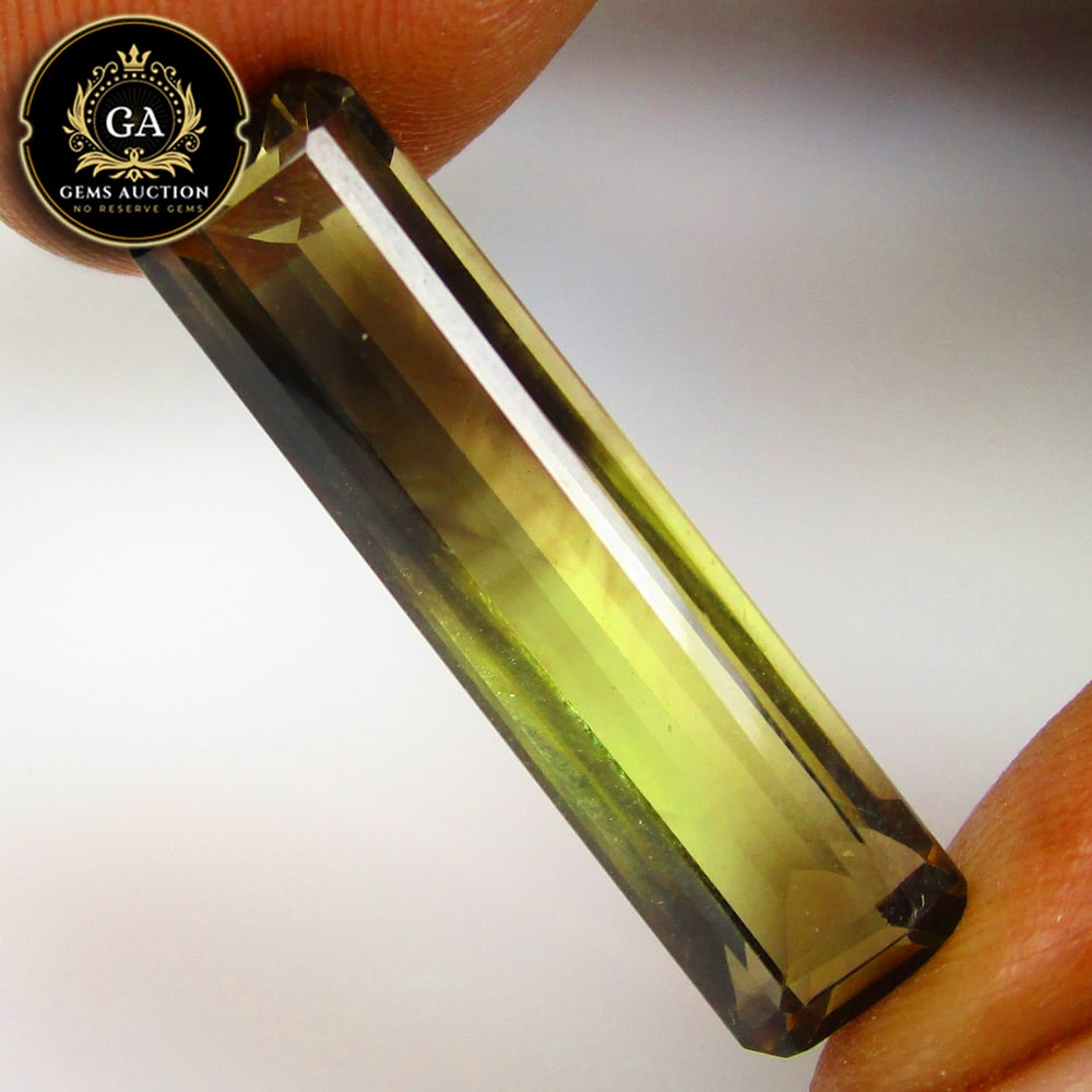 11.14 Ct Natural Bi-Color Lemon Quartz Bullet Shaped Cut: Weight - 11.14 Ct / Size - 28.00 x 7.00 x 6.70 mm / Clariry - VVS / Top Class Luster / High Class Quality / Excellent Bullet Shaped Cut / Origin - Africa / Hardness - 7.0 / Treatment - None