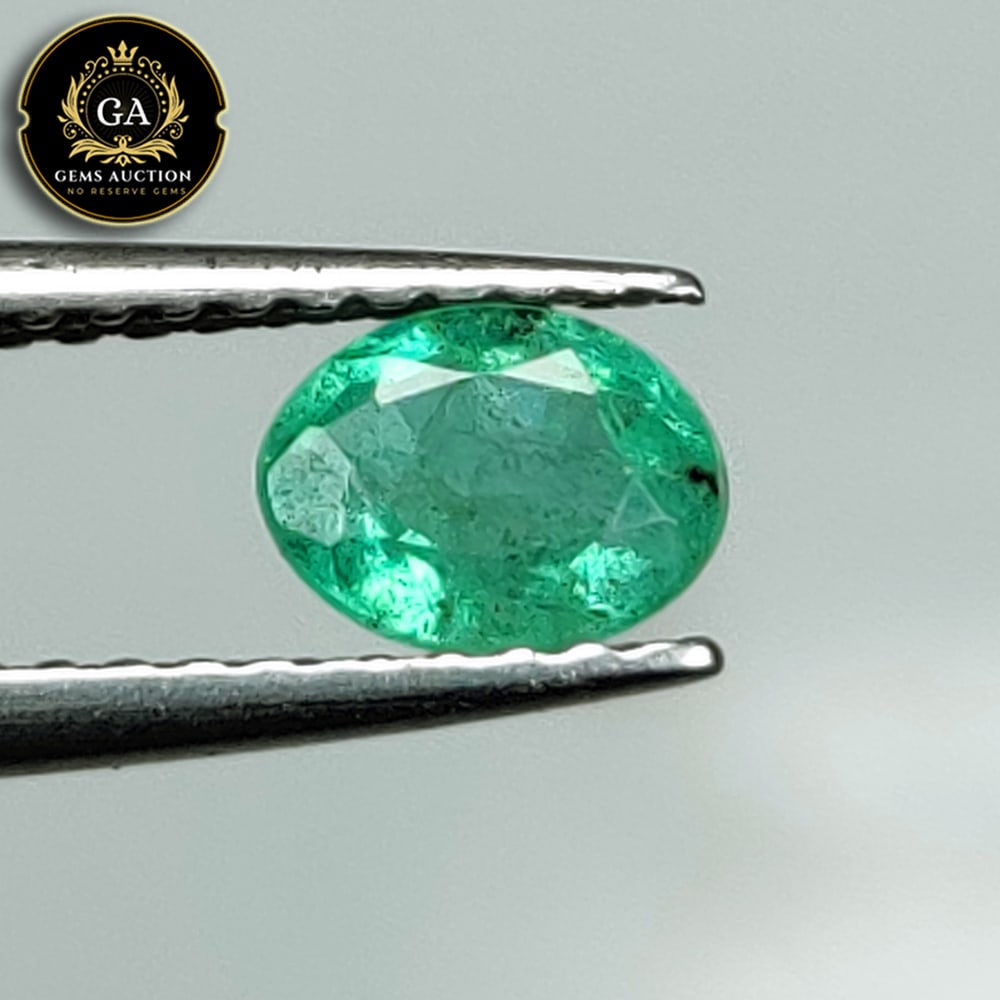 0.52 Ct Natural Grassy Green Emerald Oval Cut: Weight - 0.52 Ct / Size - 5.70 x 4.40 x 3.20 mm / Shape - Oval Cut / Color - Green / Clarity - SI / Origin - Zambia / Treatment - Colorless Oil