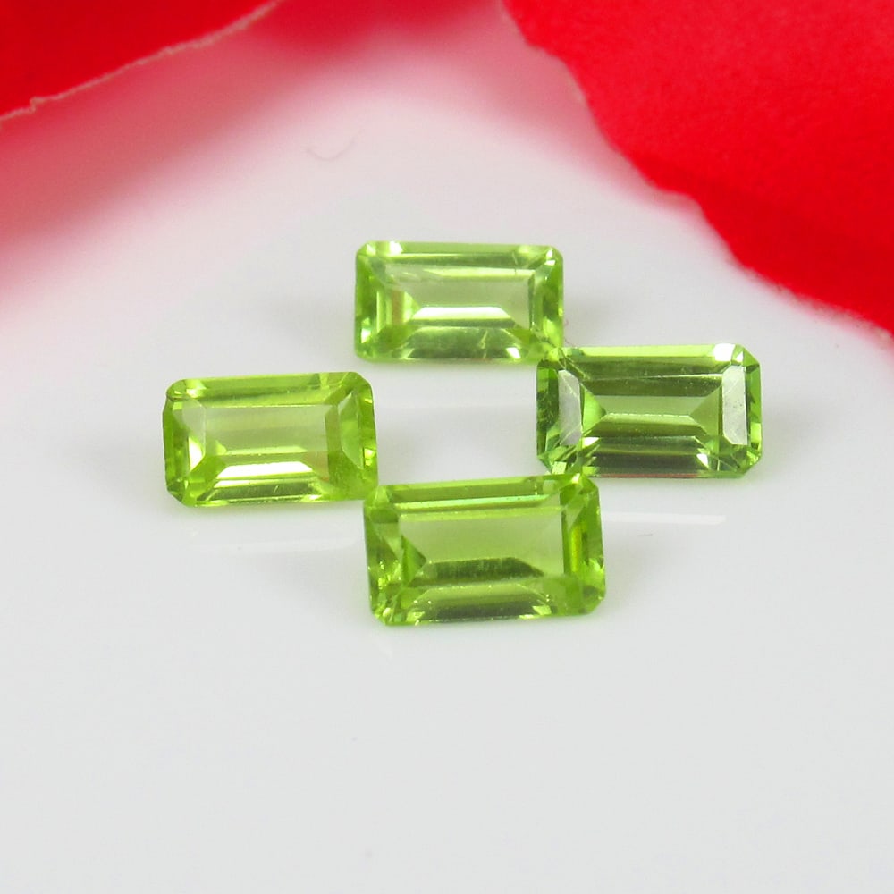 1.21 Ct Natural Parrot Green Peridot Octagon Cut Set: Weight - 1.21 Ct / Size - 5.0x3.0 - 5.1x3.1 mm / 4 Pc's / Shape - Octagon Cut / Color - Green / Clarity - VVS / Origin - Pakistan / Treatment - None