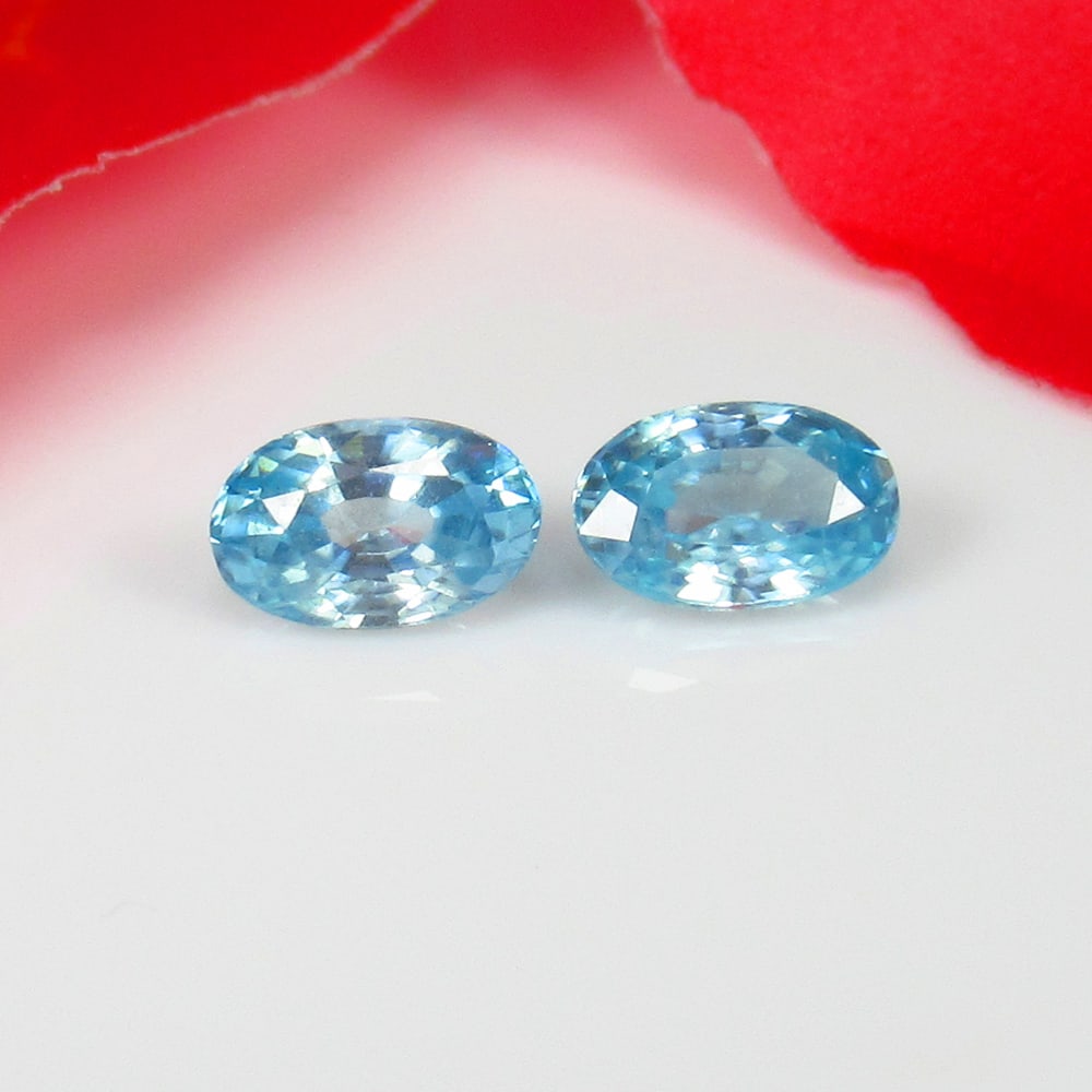 1.35 Ct Natural Blue Zircon Oval Cut Pair: Weight - 1.35 Ct / Size - 6.00 x 4.00 x 2.60 mm / 2 Pc's / Shape - Oval Cut / Color - Blue / Clarity - VVS / Origin - Cambodia / Treatment - Gentle Heat