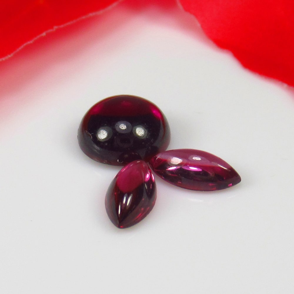 3.34 Ct Natural Rhodolite Garnet Almandine Red Round & Marquise Cab Set: Weight - 3.34 Ct / Size - 7.5x7.5 & 7.3x3.5 mm / 3 Pc's / Shape - Round & Marquise Cab / Clarity - VVS / Origin - Nigeria / Treatment - None