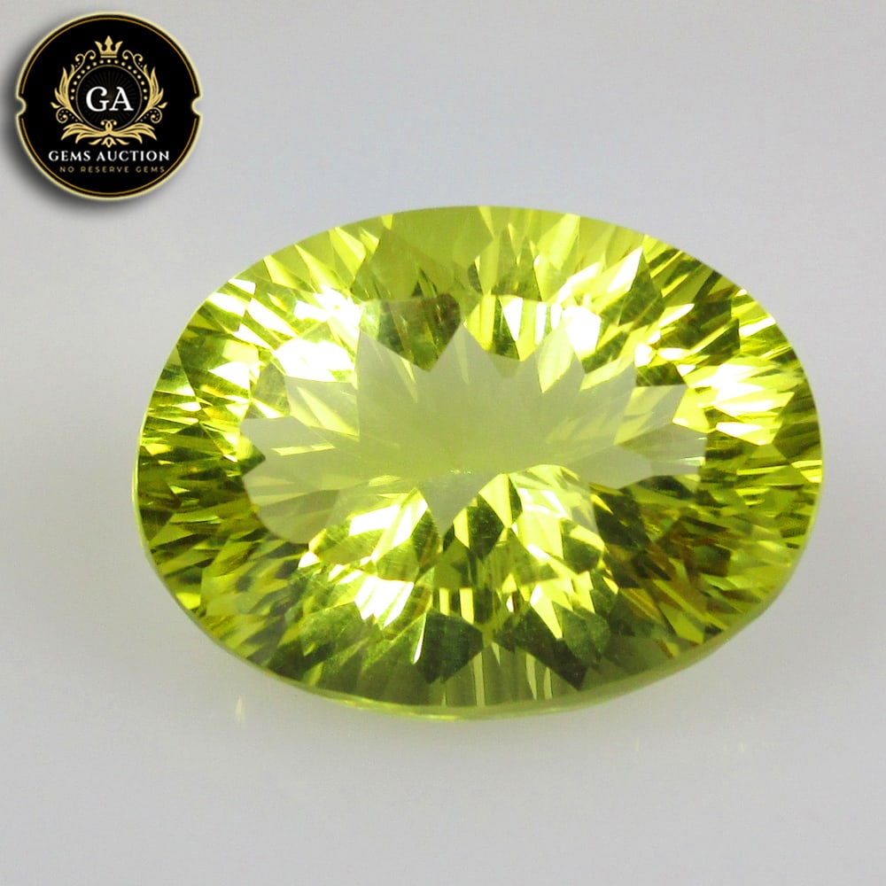 13.66 Ct Natural Lemon Quartz Oval Concave Cut: Weight - 13.66 Ct / Size - 18.80 x 14.10 x 9.60 mm / Shape - Oval Cut / Clarity - VVS / Origin - Brazil / Treatment - None