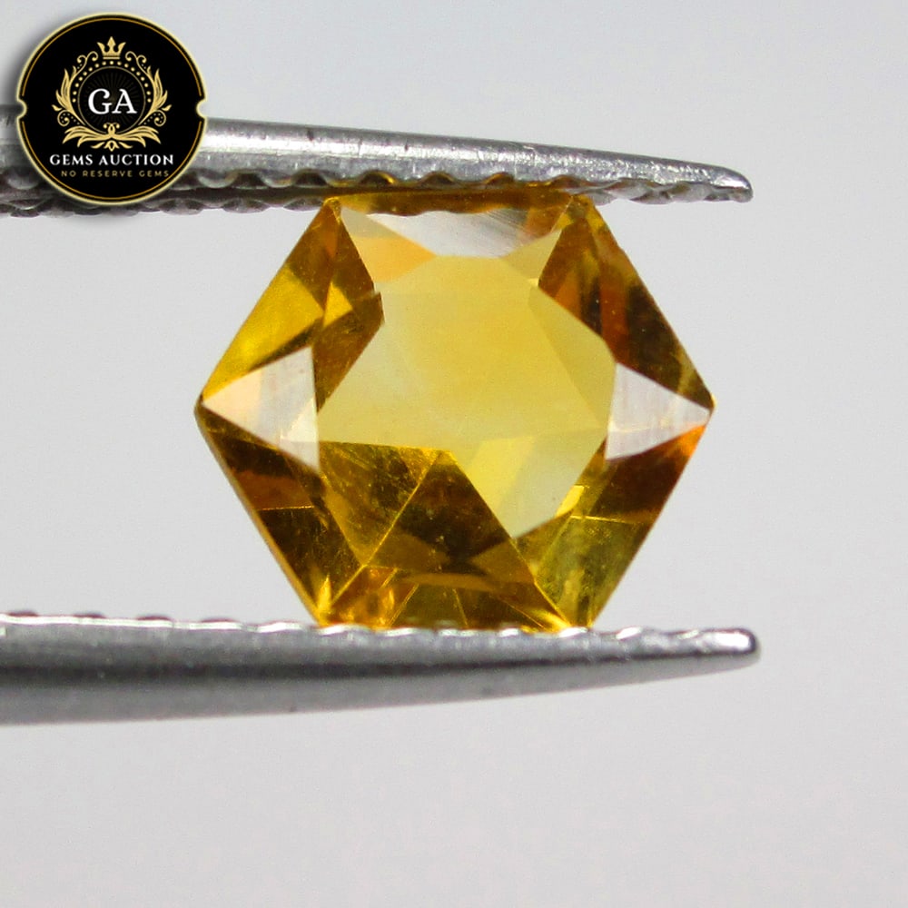 0.74 Ct Natural Golden Yellow Citrine Hexagon Cut: Weight - 0.74 Ct / Size - 6.20 x 6.20 x 3.40 mm / Shape - Hexagon Cut / Color - Yellow / Clarity - VVS / Origin - Brazil / Treatment - None