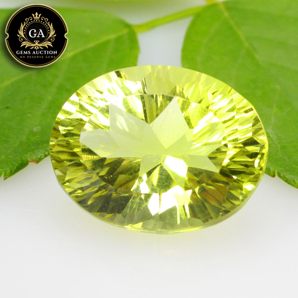13.01 Ct Natural Lemon Quartz Oval Concave Cut: Weight - 13.01 Ct / Size - 17.50 x 13.60 x 10.00 mm / Shape - Oval Concave Cut / Clarity - VVS / Origin - Brazil / Treatment - None