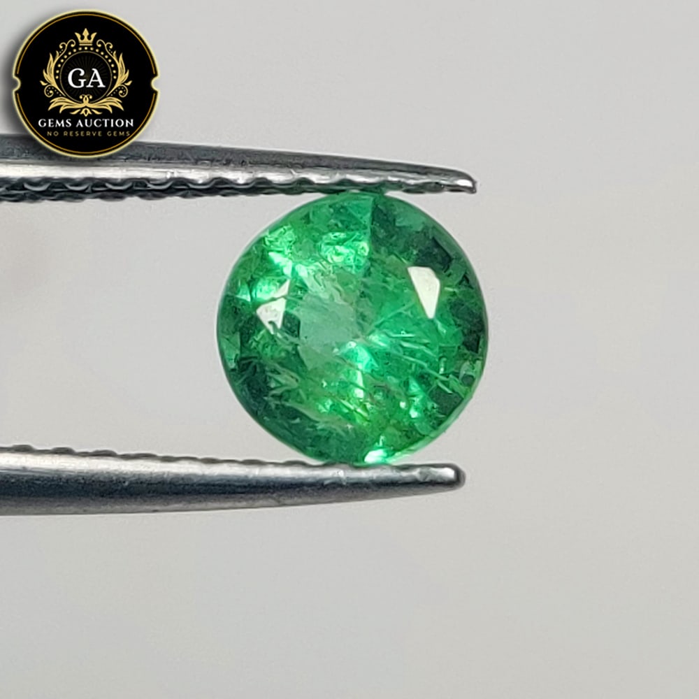 0.69 Ct Natural Grassy Green Emerald Round Cut: Weight - 0.69 Ct / Size - 5.40 x 5.40 x 4.20 mm / Shape - Round Cut / Color - Green / Clarity - SI / Origin - Zambia / Treatment - Colorless Oil