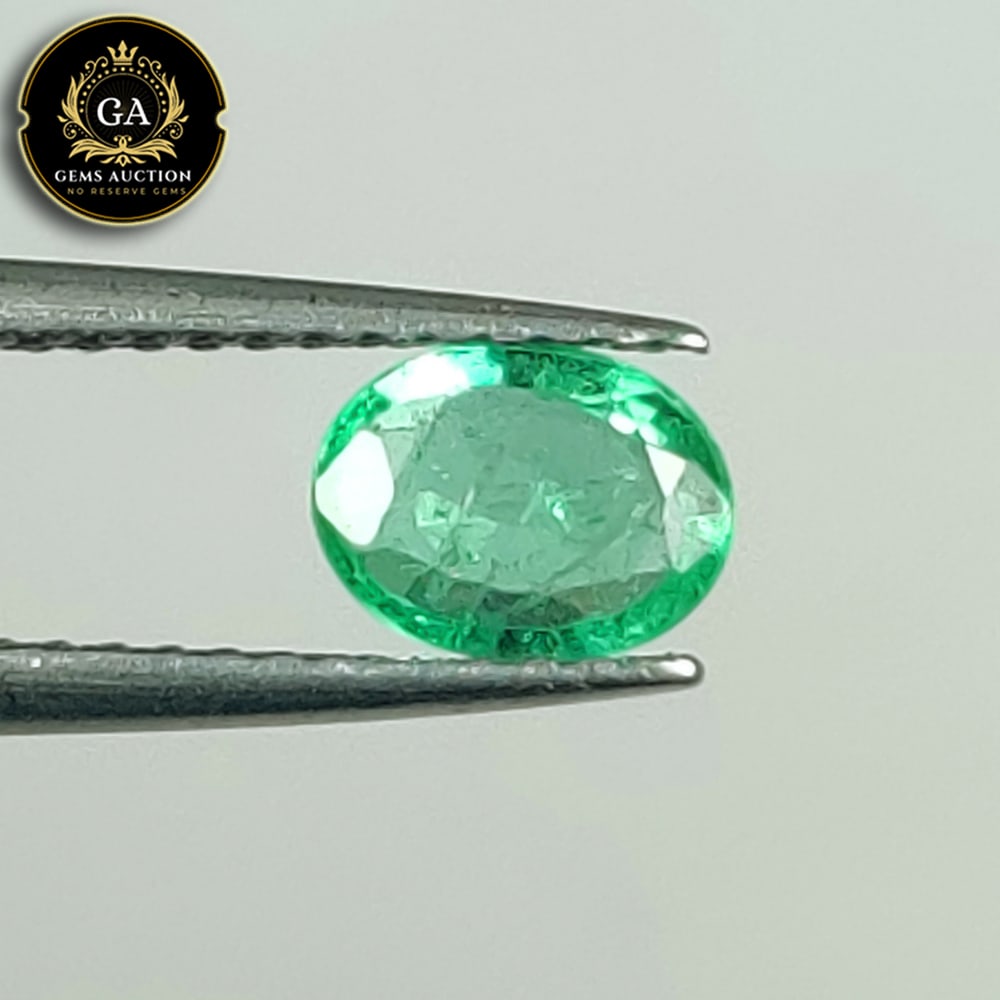 0.57 Ct Natural Grassy Green Emerald Oval Cut: Weight - 0.57 Ct / Size - 6.50 x 5.00 x 2.50 mm / Shape - Oval Cut / Color - Green / Clarity - SI / Origin - Zambia / Treatment - Colorless Oil