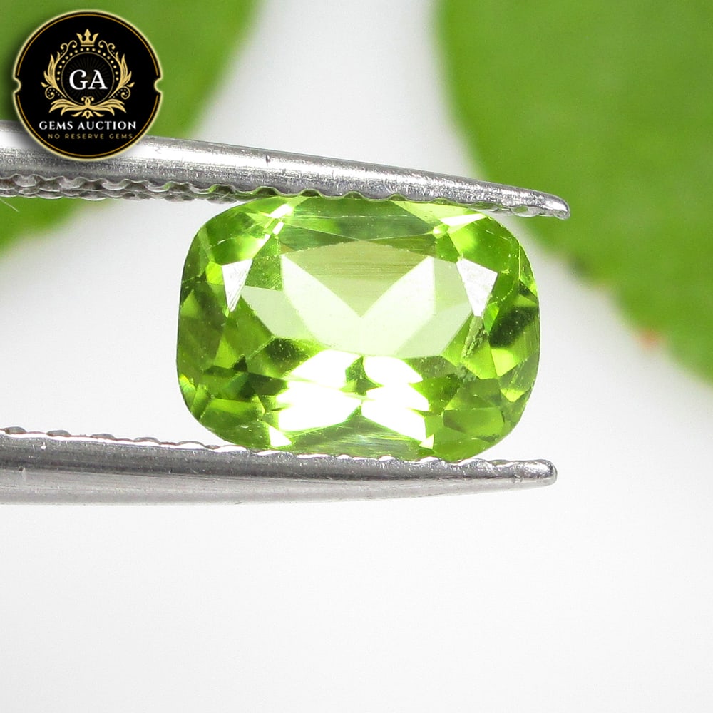 1.04 Ct Natural Parrot Green Peridot Cushion Cut: Weight - 1.04 Ct / Size - 7.20 x 5.20 x 3.70 mm / Shape - Cushion Cut / Color - Green / Clarity - VVS / Origin - Pakistan / Treatment - None