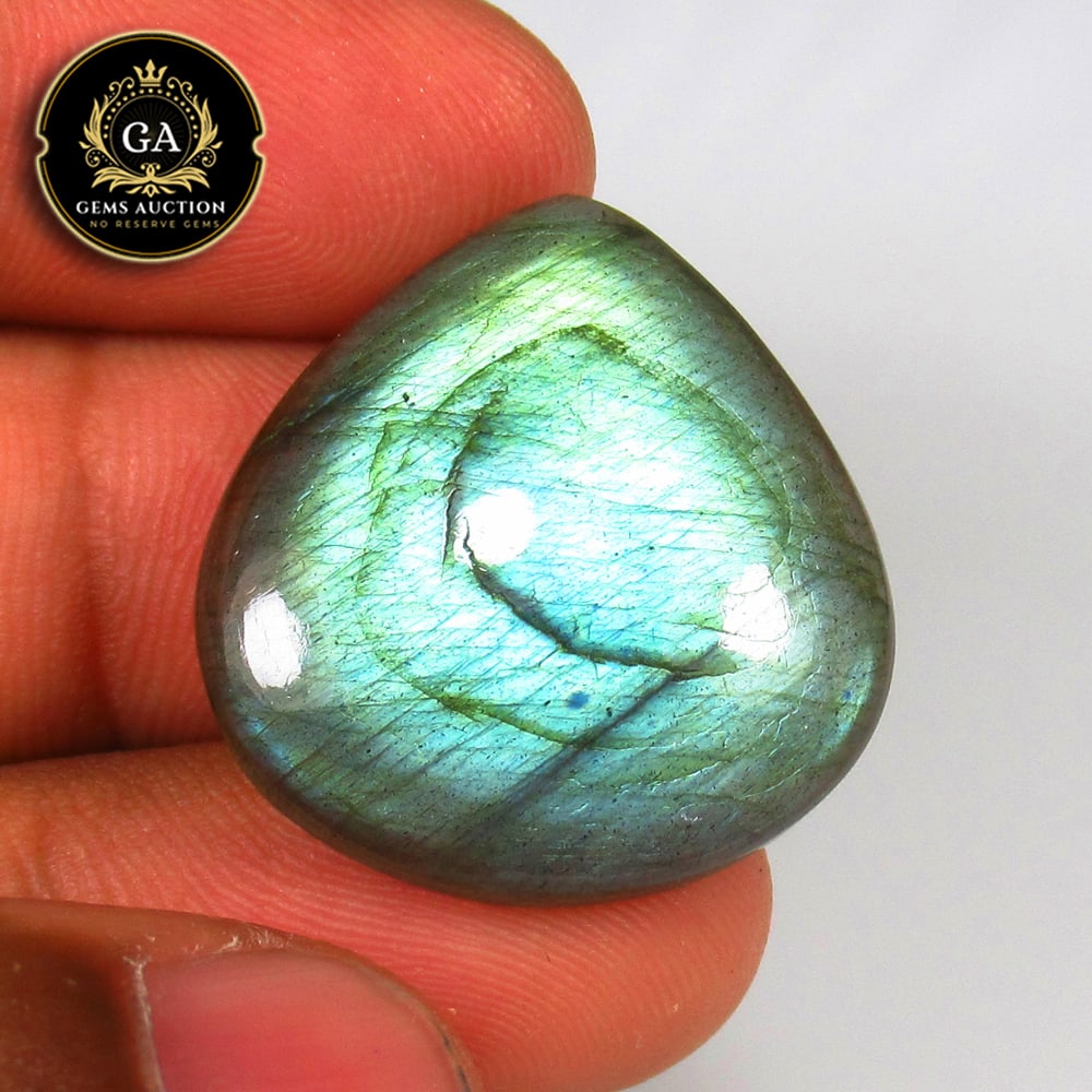 29.57 Ct Natural Labradorite Pear Cab: Weight - 29.57 Ct / Size - 27.00 x 25.00 x 5.60 mm / Shape - Excellent Pear Cabochon / Clarity - Opaque / Origin - Africa / Treatment - None