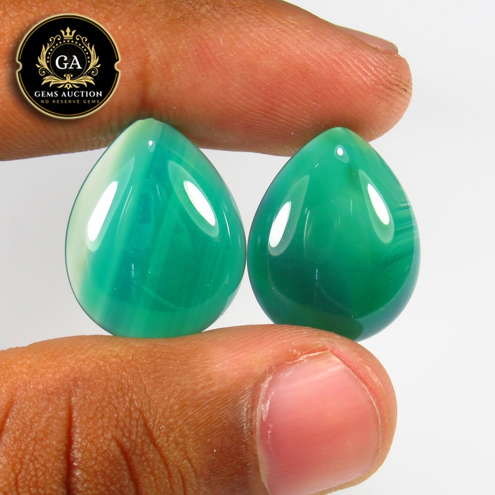 22.34 Ct Natural Green Onyx Pear Cab Pair: Weight - 22.34 Ct / Size - 20.00 x 16.00 x 5.00 mm / 2 Pc's / Shape - Pear Cab / Color - Green / Clarity - OPaque / Origin - Africa / Treatment - None