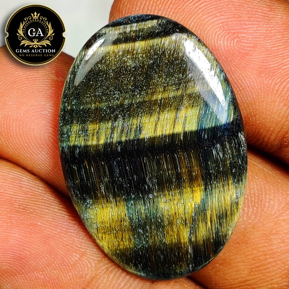 22.55 Ct Natural Hypersthene Oval Cab (1 of 3)