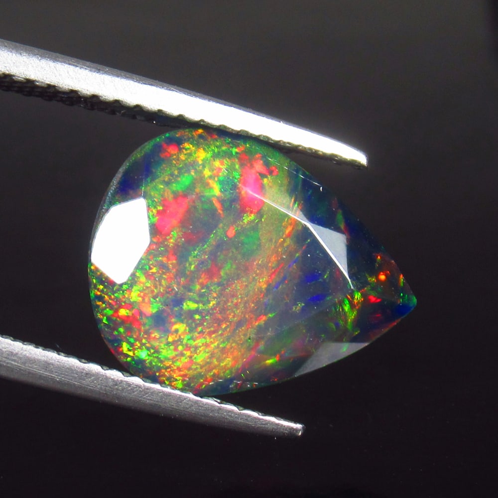 3.09 Ct Natural Black Top Flash Fire Opal Pear Cut (1 of 3)