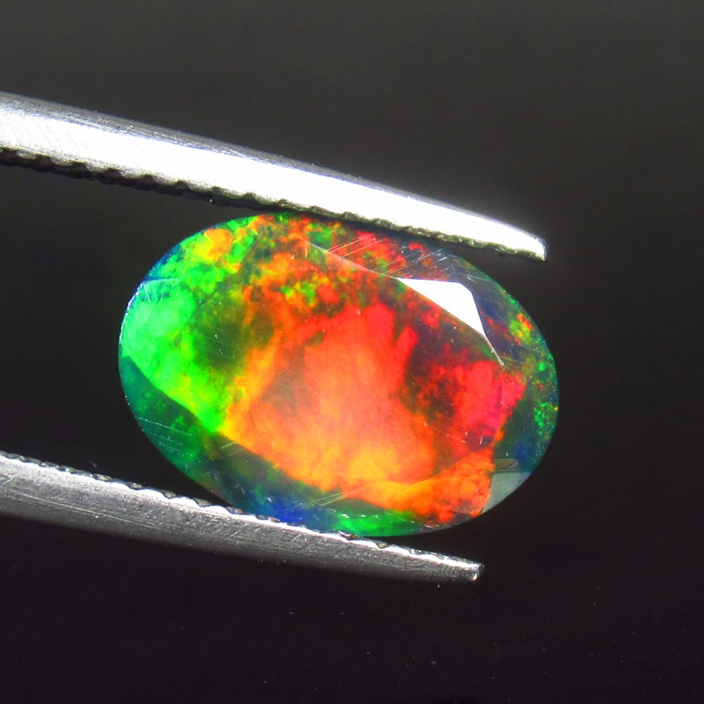 1.55 Ct Natural Black Top Flash Fire Opal Oval Cut (1 of 3)