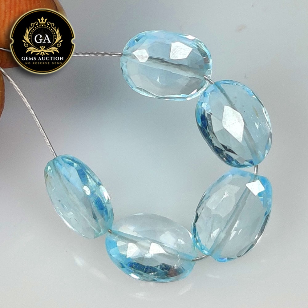 10.24 Ct Natural Blue Topaz Drilled Dumble Beads: Weight - 10.24 Ct / Size - 8.6x6.5 - 9.2x6.7 mm / 5 Pc's / Shape - Dumble Beads / Color - Blue / Clarity - VVS / Origin - Brazil / Treatment - Irradiated