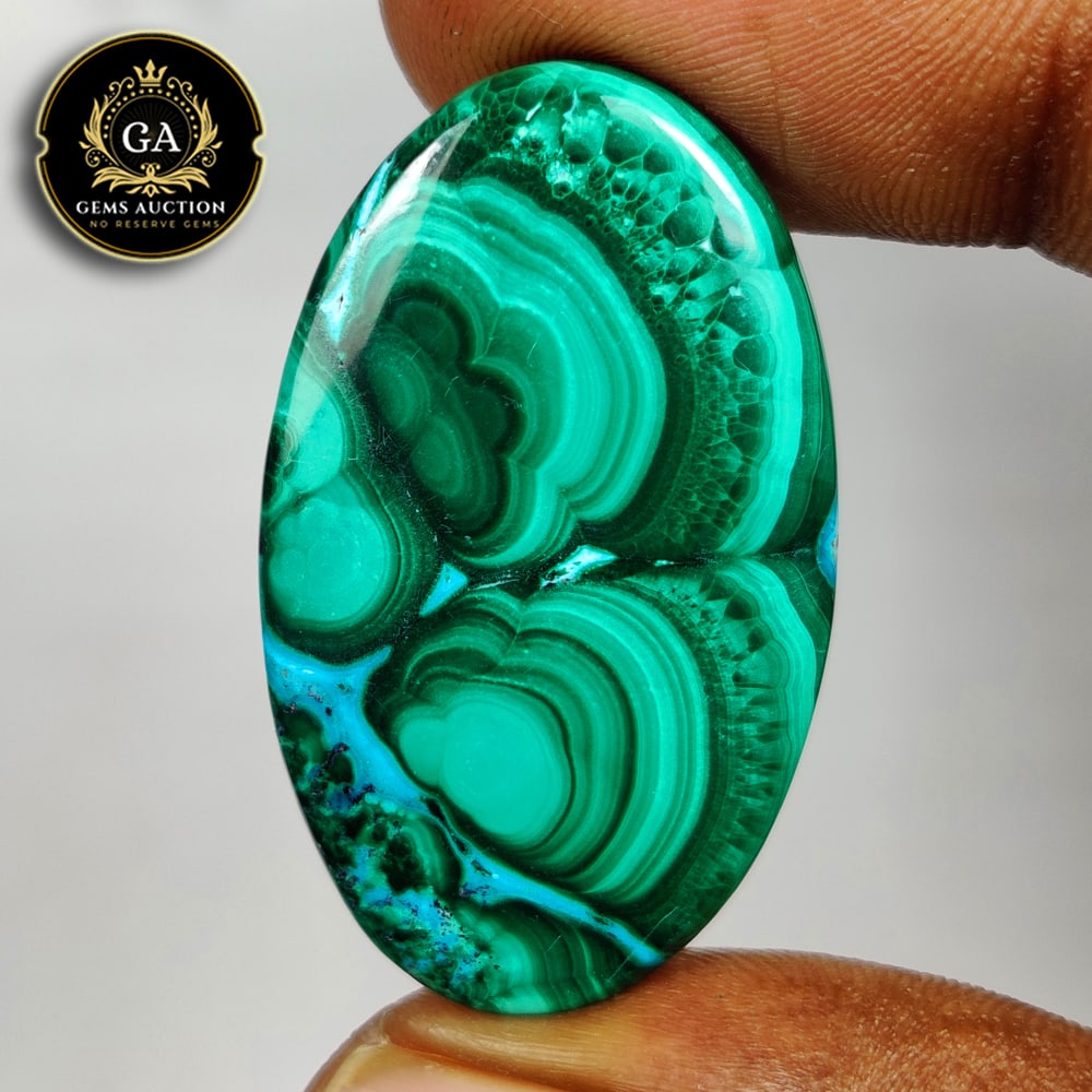 66.06 Ct Natural Green Malachite Oval Cab: Weight - 66.06 Ct / Size - 38.00 x 23.00 x 6.70 mm / Shape - Oval Cab / Color - Green / Clarity - Opaque / Origin - Russia / Treatment - None