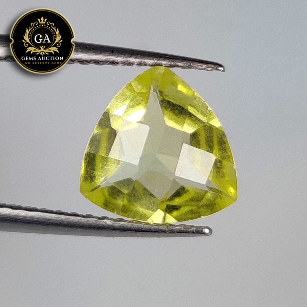 1.55 Ct Natural Lemon Quartz Trillion Cut: Weight - 1.55 Ct / Size - 8.60 x 8.50 x 4.80 mm / Shape - Trillion Cut / Clarity - VVS / Origin - Brazil / Treatment - None